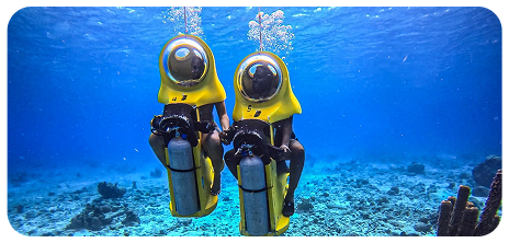A couple on an underwater scooter tour